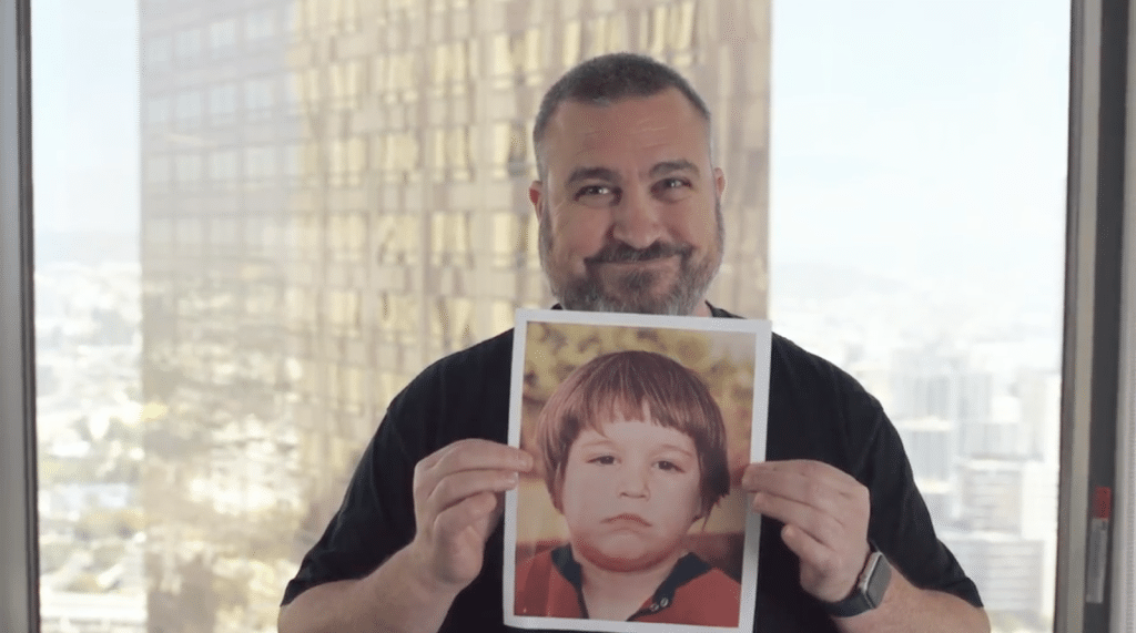 Boaz Shor holding his childhood photo